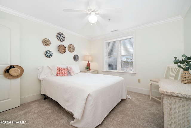 carpeted bedroom with ceiling fan and crown molding