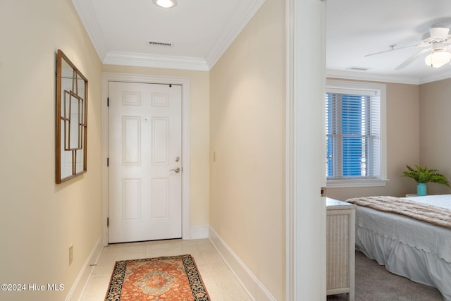 doorway to outside featuring ceiling fan, light tile patterned flooring, and crown molding