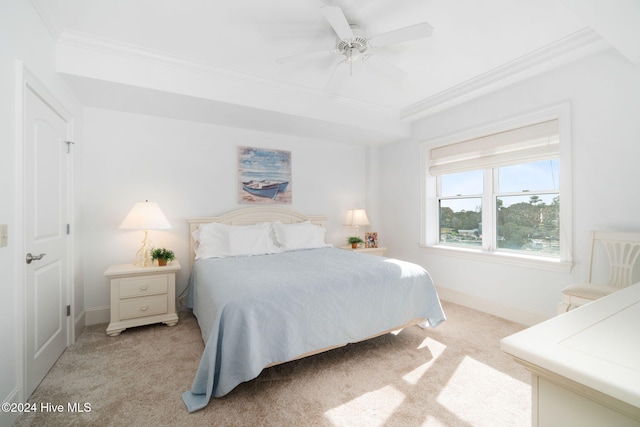 bedroom with ceiling fan, ornamental molding, and light carpet