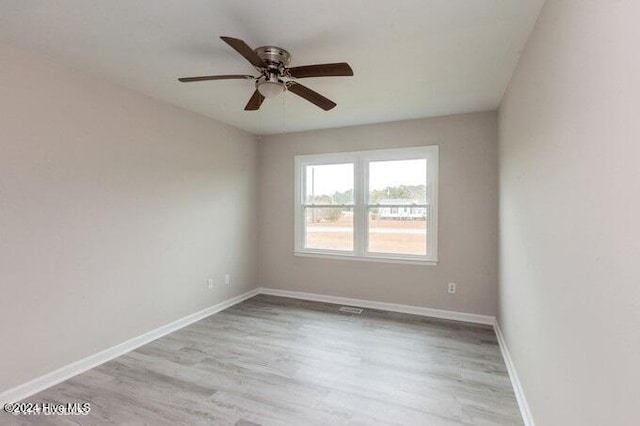 unfurnished room featuring ceiling fan and light hardwood / wood-style flooring