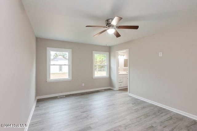 spare room with ceiling fan and light hardwood / wood-style flooring