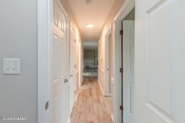 hall with light hardwood / wood-style floors