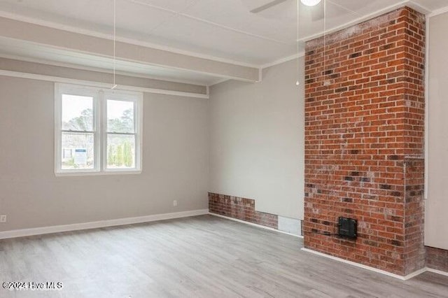 spare room with beamed ceiling, hardwood / wood-style floors, ceiling fan, and ornamental molding