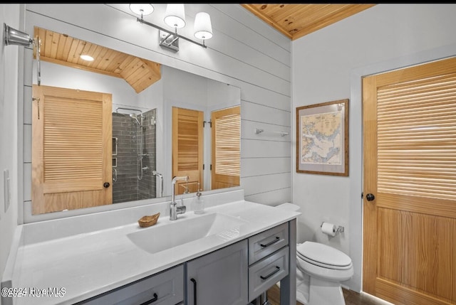 bathroom with wood ceiling, a tile shower, vanity, toilet, and wood walls