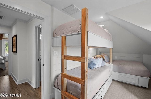 bedroom featuring wood-type flooring and crown molding