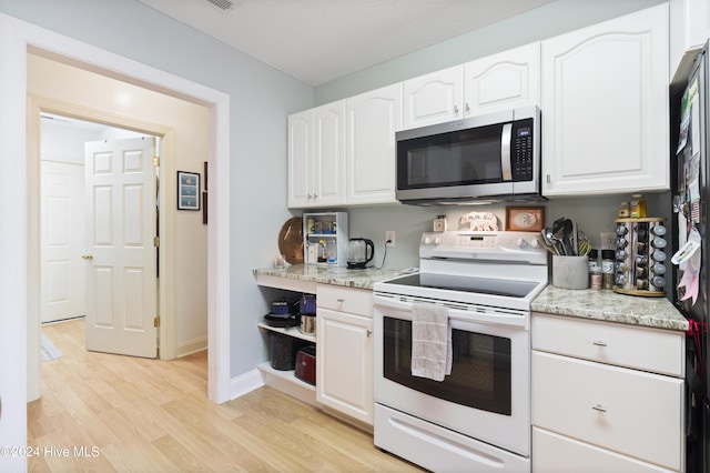 kitchen with white cabinetry, light stone countertops, white electric range, and light hardwood / wood-style flooring