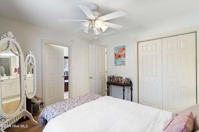 bedroom with connected bathroom, ceiling fan, a closet, and hardwood / wood-style floors