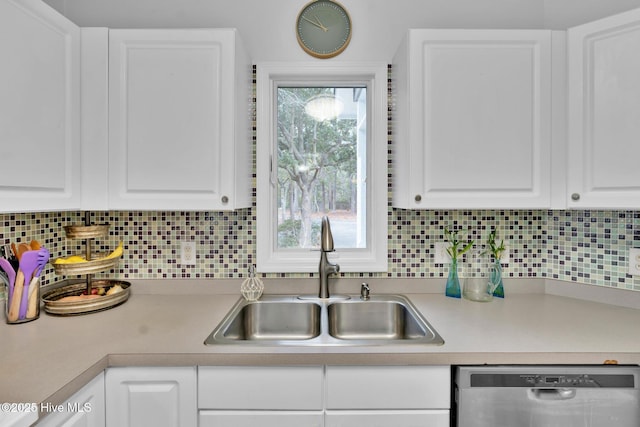 kitchen featuring stainless steel dishwasher and white cabinets