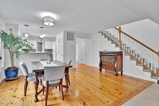 dining room featuring light wood-type flooring