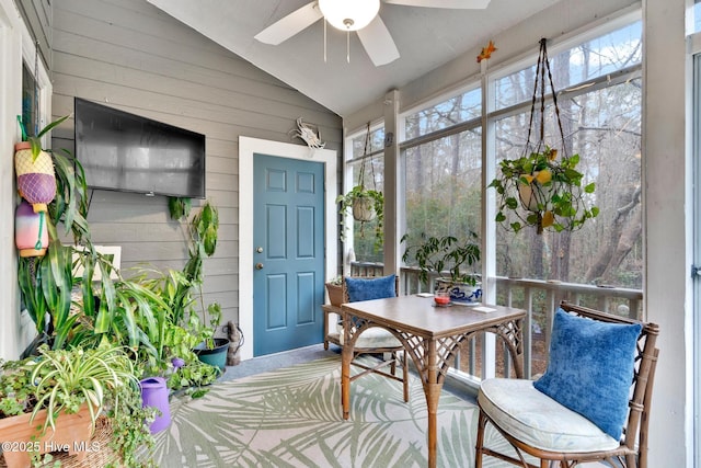 sunroom with vaulted ceiling and ceiling fan