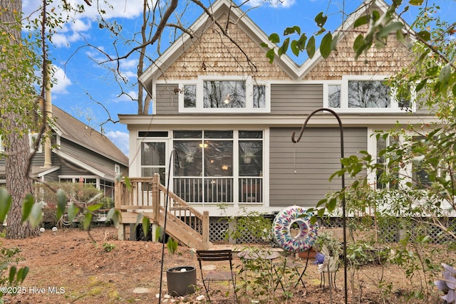 rear view of house with a sunroom