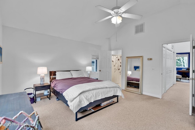 carpeted bedroom featuring ceiling fan and high vaulted ceiling