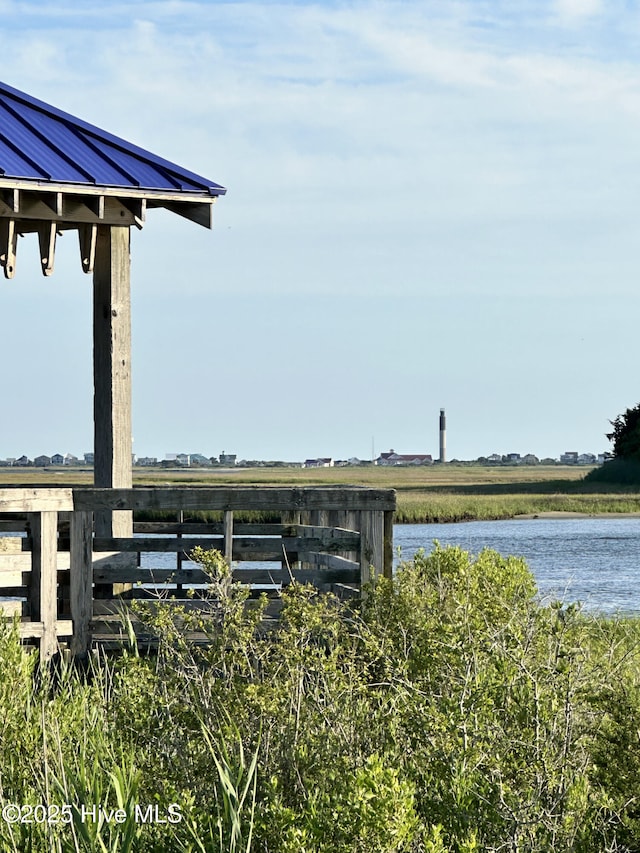 view of community with a water view