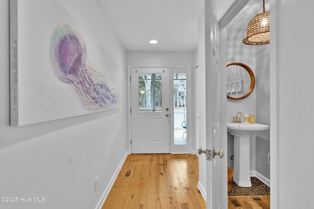 doorway to outside featuring light hardwood / wood-style floors