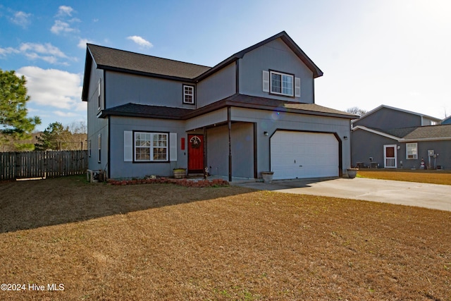 front facade with a front yard and a garage