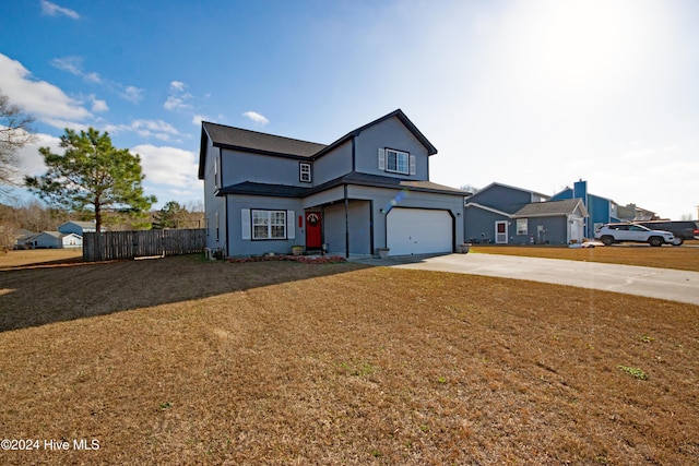 front of property featuring a front yard and a garage