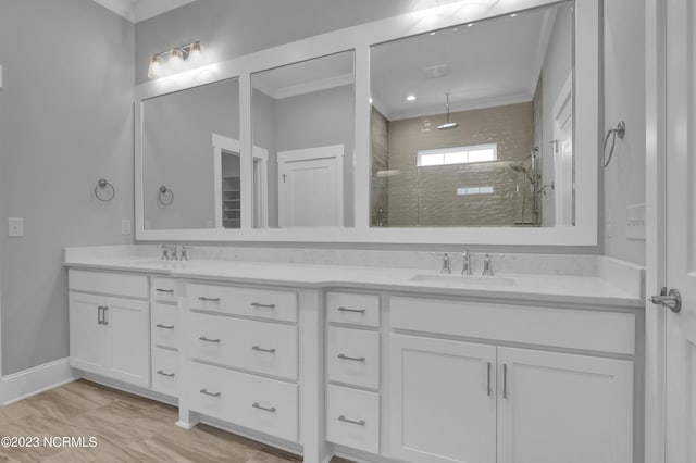 bathroom featuring vanity, walk in shower, and crown molding