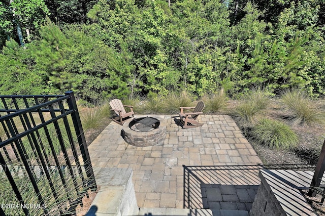 view of patio / terrace featuring an outdoor fire pit