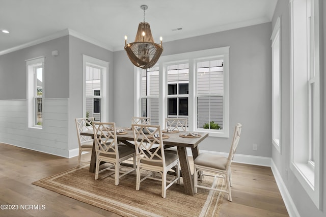 dining area featuring plenty of natural light and wood-type flooring