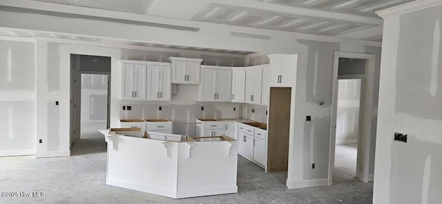 kitchen featuring white cabinetry and a kitchen island