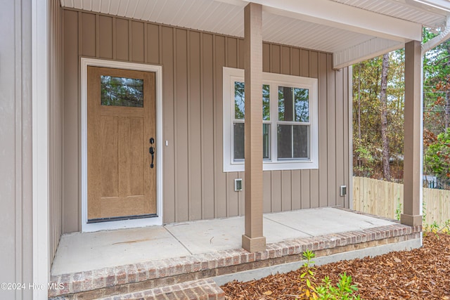 doorway to property featuring covered porch