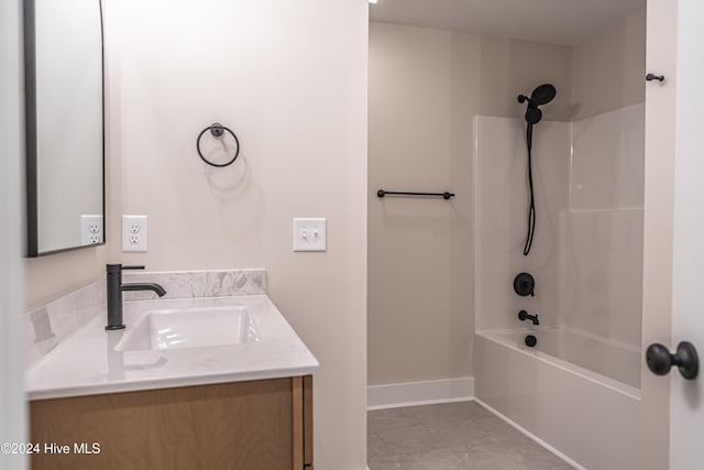 full bath featuring baseboards, shower / washtub combination, and vanity