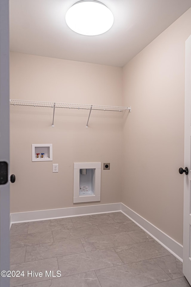 laundry room with laundry area, hookup for an electric dryer, baseboards, and washer hookup