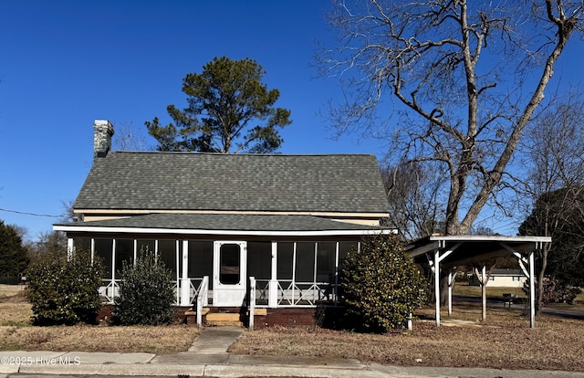 view of front facade with a carport