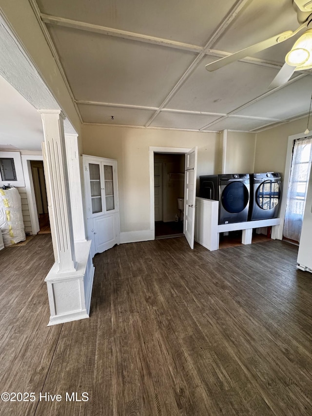 washroom featuring ornate columns, washing machine and dryer, dark wood-type flooring, and ceiling fan