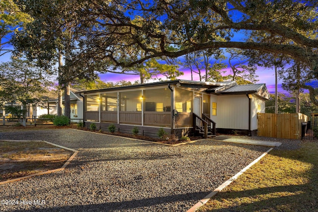 view of front of property with a sunroom