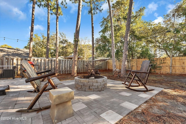 view of patio / terrace featuring an outdoor fire pit