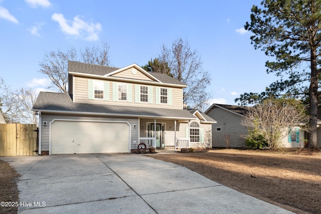 view of front property featuring a porch and a garage