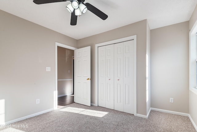 unfurnished bedroom featuring ceiling fan, carpet floors, and a closet