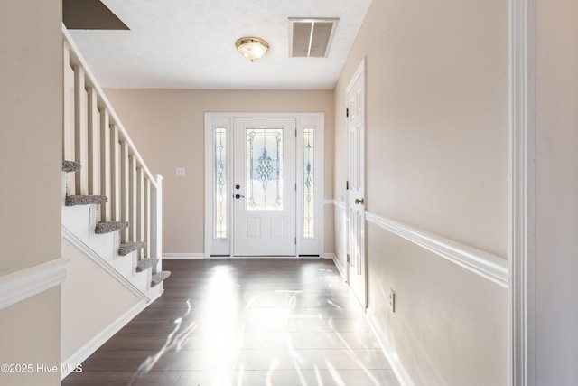 entrance foyer featuring dark wood-type flooring