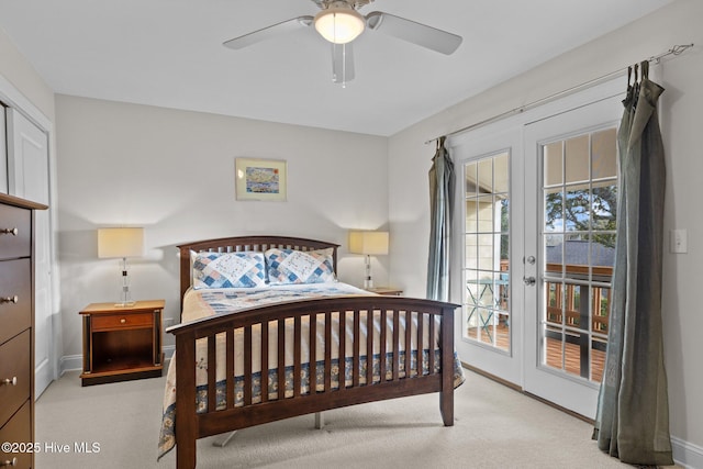 carpeted bedroom featuring ceiling fan, access to outside, and french doors