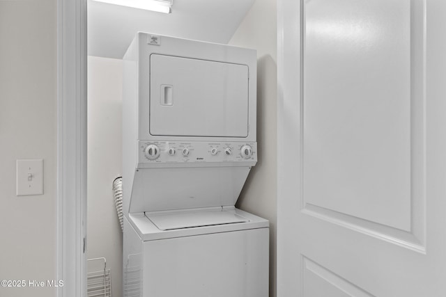 washroom with stacked washer and clothes dryer