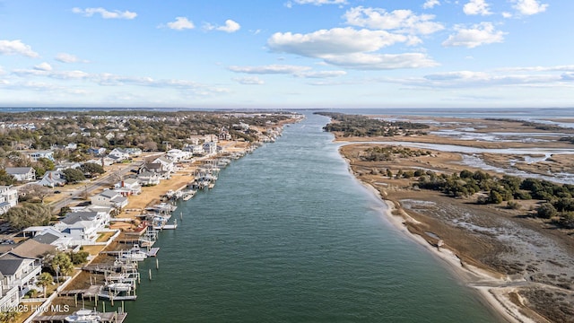 bird's eye view featuring a view of the beach and a water view