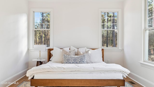 bedroom with wood-type flooring