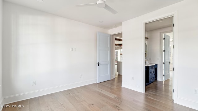 unfurnished bedroom featuring ceiling fan and light wood-type flooring