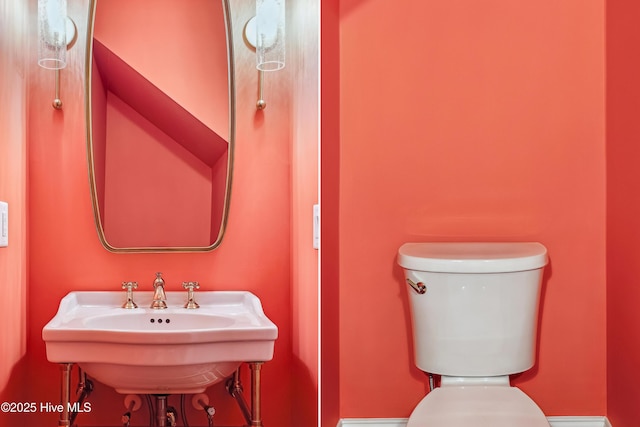 bathroom featuring toilet and sink