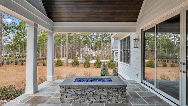 view of patio / terrace featuring a fire pit