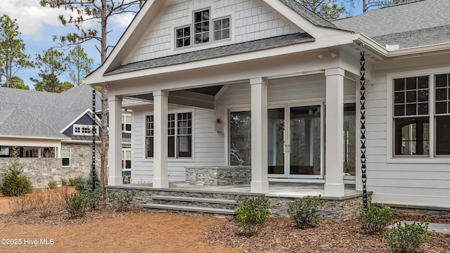 property entrance with covered porch