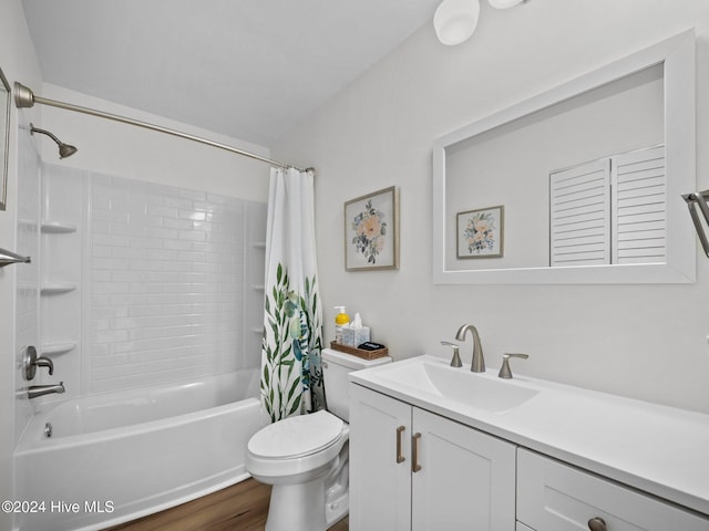 full bathroom with hardwood / wood-style floors, vanity, toilet, and shower / bath combination with curtain