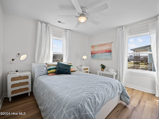 bedroom featuring hardwood / wood-style floors and ceiling fan