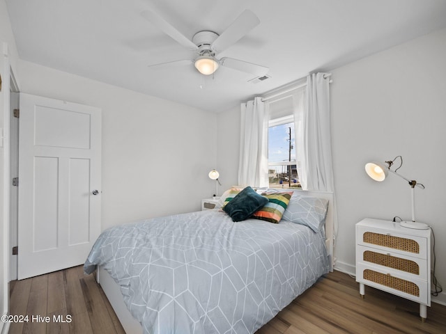 bedroom featuring hardwood / wood-style floors and ceiling fan