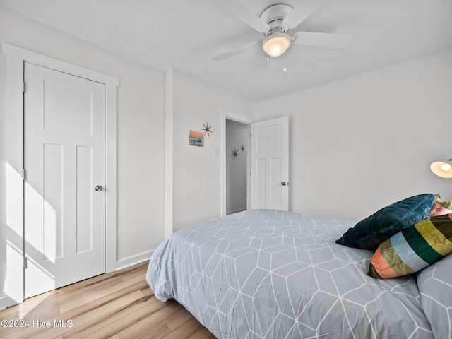 bedroom with hardwood / wood-style floors and ceiling fan