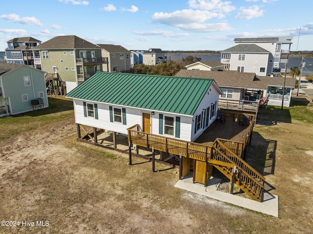 back of house featuring a wooden deck