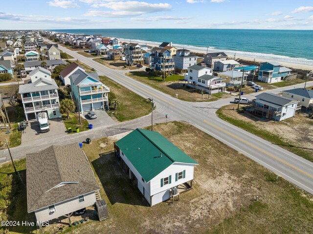 aerial view with a water view and a view of the beach