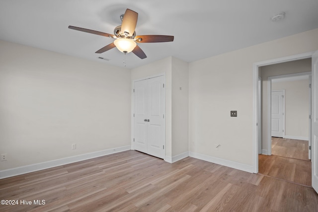 unfurnished room featuring ceiling fan and light hardwood / wood-style flooring