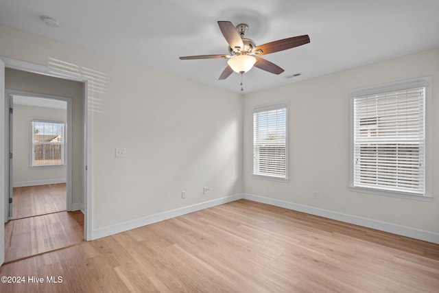 unfurnished room featuring ceiling fan and light hardwood / wood-style flooring